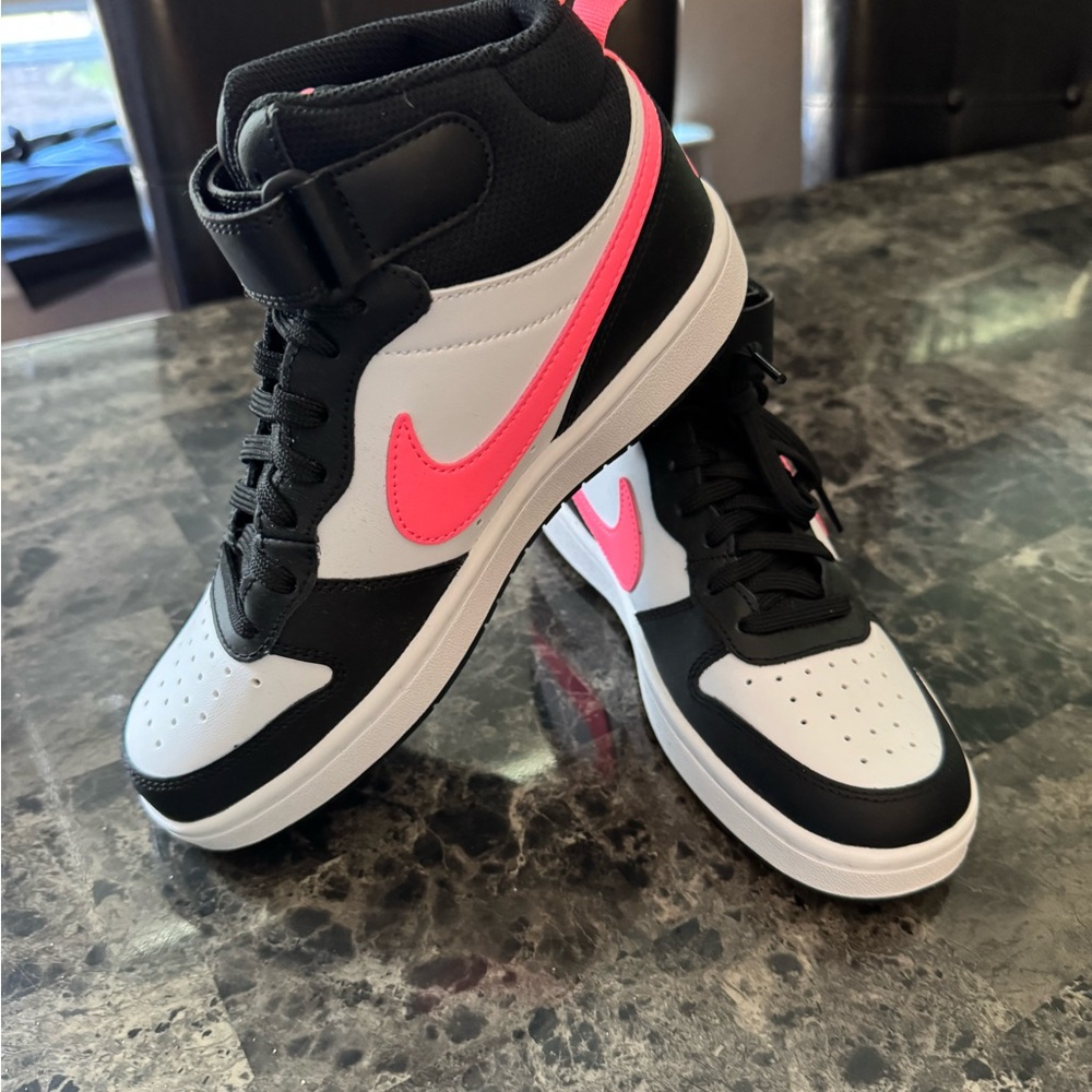 NEW‼️
Nike Black and White High-Top Sneakers with Pink Swoosh